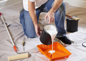 a man pouring paint